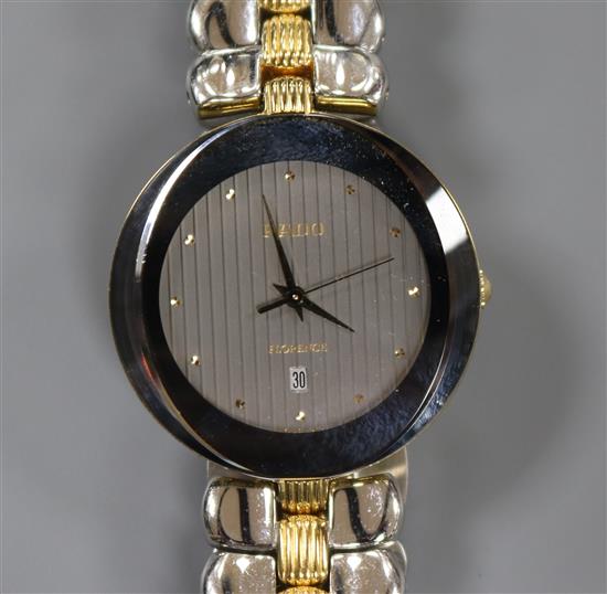 A gentlemens Rado Florence wristwatch with oval grey dial, dot markers and date aperture,